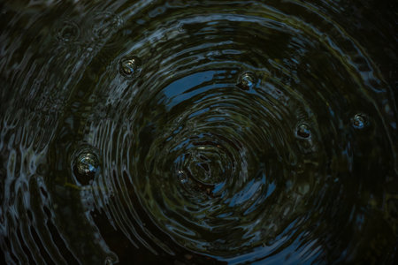 Circles on the surface of the water. Abstract background.の写真素材