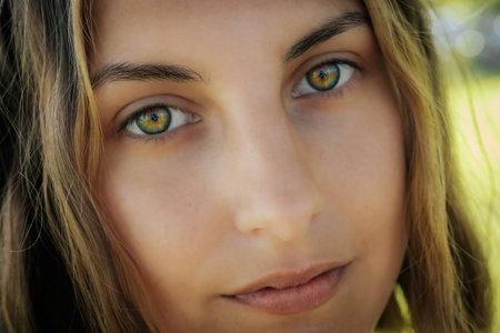 Portrait of a young beautiful girl with green eyes. Close-up.の写真素材