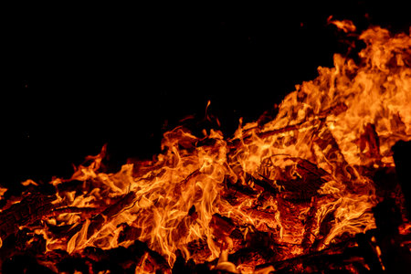 Fire flames on a black background, close-up, fire backgroundの写真素材