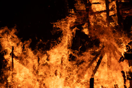 Fire flames on a black background, close-up of photo.