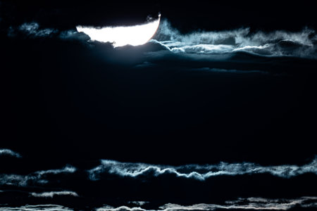Moon in the night sky with cloudsbe used as background