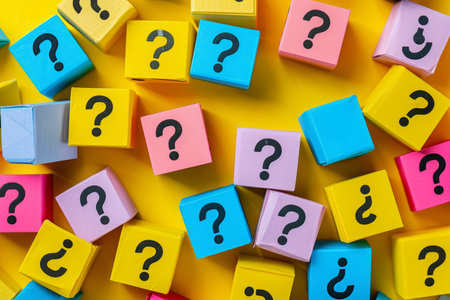 Scattered question marks with space for answers through self education analysis curiosity and reasoning to achieve clarityの素材