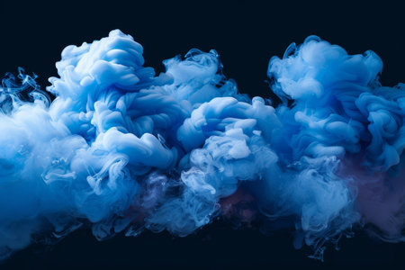 A dramatic burst of blue smoke expands against a solid black background, creating a striking contrast. The swirling, cloud like formation captures the dynamic motion and intensity of the explosion. AI generated.の素材