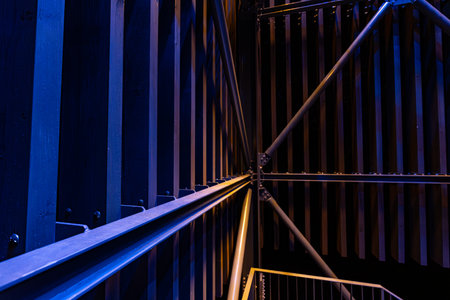 Blue metal stairs in the dark, close-up. Abstract background