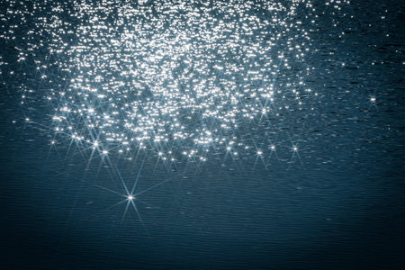 Water surface with stars and bokeh lights. Abstract background.の写真素材