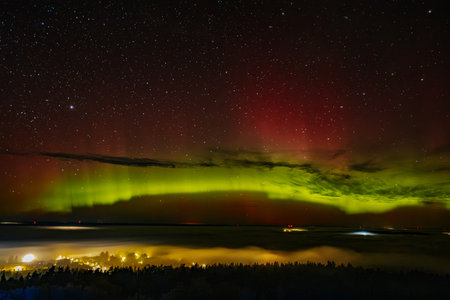 Aurora borealis, northern lights, over the lake.の写真素材