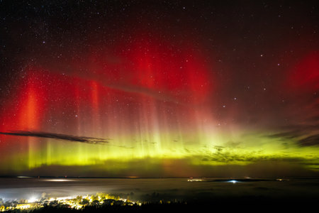 Aurora borealis, northern lights, over the lake.の写真素材