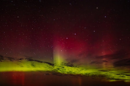 Aurora borealis, northern lights and stars in the night skyの写真素材