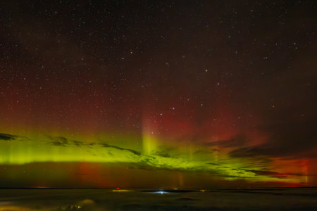 Aurora borealis, northern lights over the sea in Icelandの写真素材