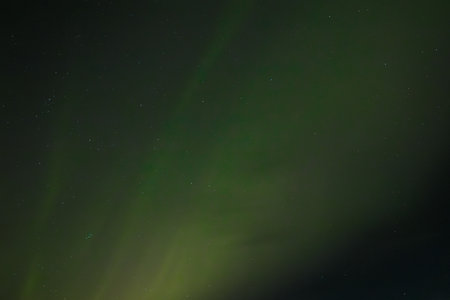 Aurora borealis in the night sky, northern lights.の写真素材