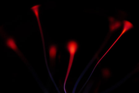abstract background of red and blue lights on a black background.の写真素材