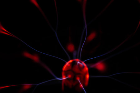 A closeup shot of a plasma ball on a black background with copy spaceの写真素材