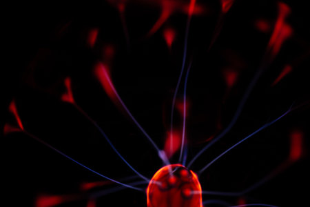 Close-up of a red lamp on a black background. Shallow depth of fieldの写真素材