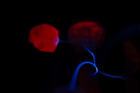 Abstract background with a lot of red and blue lights on a black backgroundの写真素材