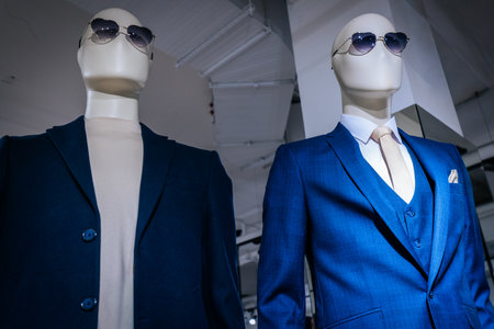 Mannequins with blue suit and sunglasses in fashion store.の写真素材