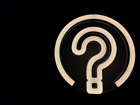 Question mark on a black background. The concept of search for answers.の写真素材