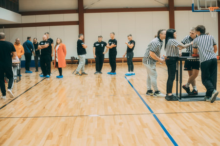 Unidentified players play basketball indoors.のeditorial素材