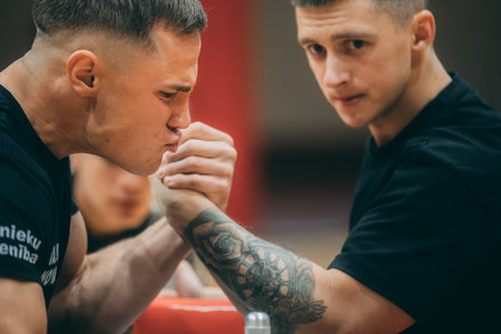 Two tattooed men are boxing in the gym. They are looking at each other.のeditorial素材