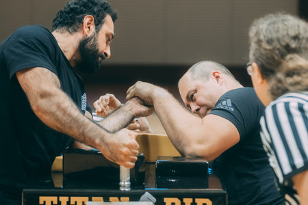 Close-up of a young man and his trainer during a workoutのeditorial素材