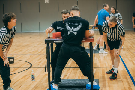 Unidentified players play basketball indoors.のeditorial素材
