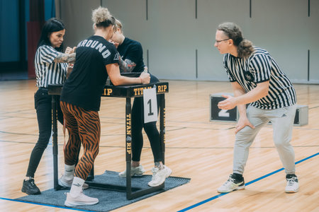 Young men play basketball on the parquet floor.のeditorial素材