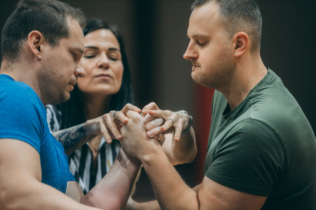 A group of young people practicing Tai Chi in a fitness studio.のeditorial素材