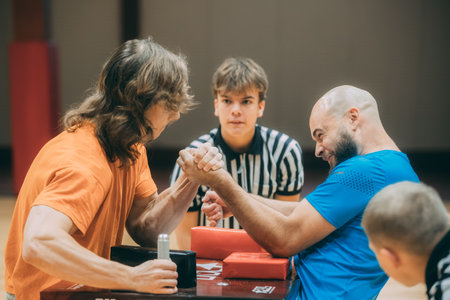 Group of young people playing basketball at gym. Selective focus.のeditorial素材