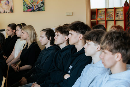 Valmiera, Latvia - March 17, 2026: Young individuals attentively seated in a classroom, engaged in a...