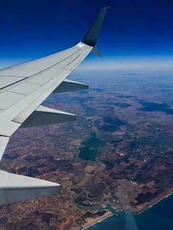 Aerial daylight scene shot at big altitude from the plane showing the amazing earth.の写真素材