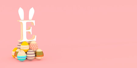 Wooden Easter eggs with the letter E of the alphabet, rabbit earsの写真素材