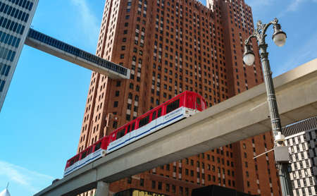 Detroit People Mover train between the Guardian Building and One Woodward in downtown Detroit, Michigan, USAのeditorial素材