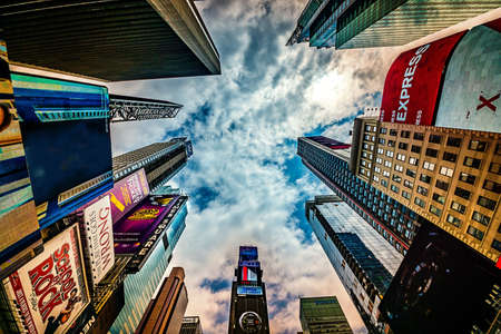 New York City - June 14, 2017: High rising skyscrapers at Times Square in NYC. The place is famous as world's busiest place for pedestrians and an iconic landmark in Manhattan, America.のeditorial素材
