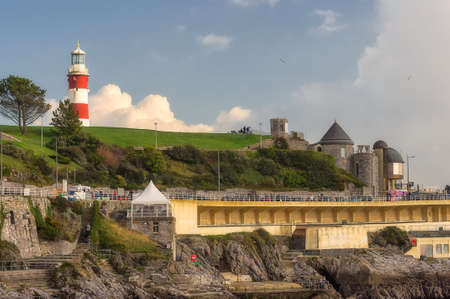 Plymouth Hoe and the Smeaton\'s Tower standing on a hill against the November skyのeditorial素材