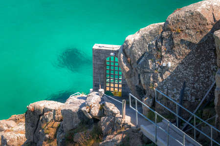 Porthcurno beach, a charming place in English Cornwall. Remains of an old building on the hill.