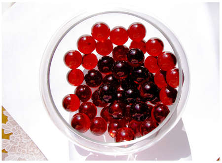 red crystals in a bowlの写真素材