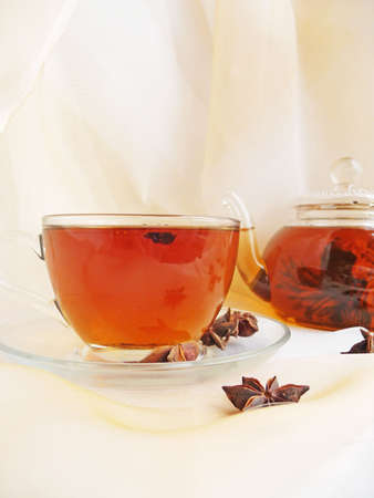 glass cup of tea and teapotの写真素材