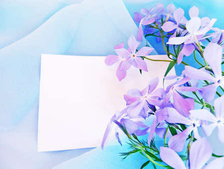 card in blue fabric and flowers