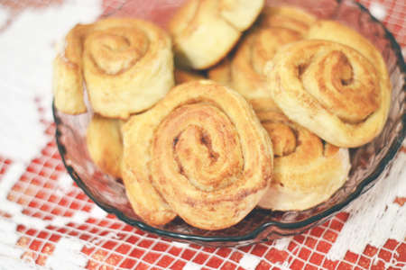 delicious homemade buns in a basket on the table