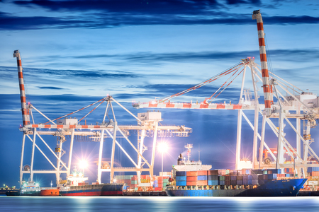 Logistic Import Export background, Container Cargo freight ship with working crane bridge in shipyard at twilight sky, Shipping, Logistics.の写真素材