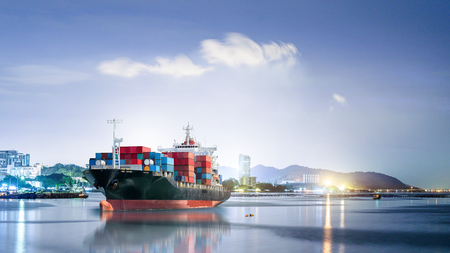 Logistics and transportation of International Container Cargo ship in the ocean at night sky, Freight Transportation, Shippingの写真素材