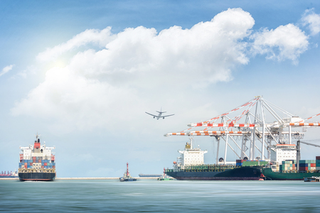 Container cargo ship and cargo plane with port crane bridge in harbor, Freight Transportation, Shippingの写真素材
