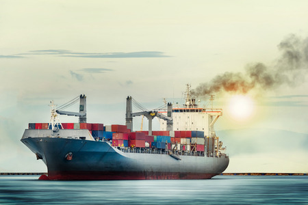 International Container Cargo ship in the ocean as sunset sky, Freight Transportation, Shippingの写真素材