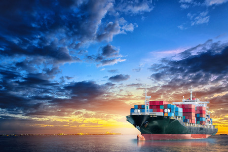Logistics and transportation of International Container Cargo ship in the ocean at twilight sky, Freight Transportation, Shippingの写真素材