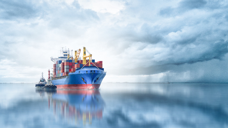 Logistics and transportation of International Container Cargo ship with tugboat in the ocean, Freight Transportation, Shippingの写真素材