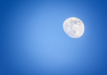 full moon in blue skyの写真素材