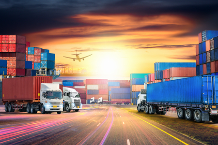 Logistics import export background and transport industry of Container Cargo freight ship and Cargo plane at sunset skyの写真素材