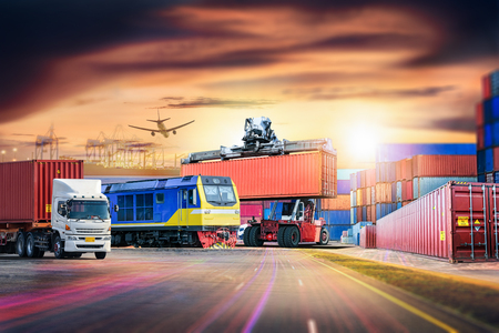 Logistics import export background and transport industry of Container Cargo freight ship and Cargo train at portの写真素材