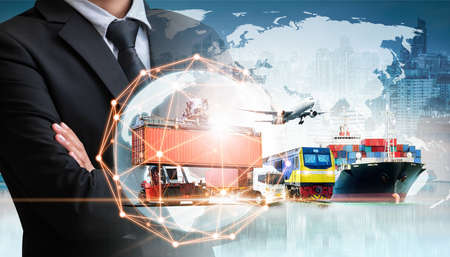 Businessman holding digital globe in palm for logistics import export background and container cargo freight ship transport conceptの写真素材