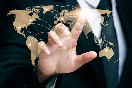 businessman touching world map screen for connections, global business technology conceptの写真素材