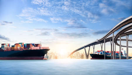 Container cargo ship in the ocean at city background with copy space, Global business logistics import export, Freight transportation, Shippingの写真素材